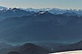 Mount Watson (centered) seen from the slopes of Mount Baker. Bacon Peak to left, Baker Lake at bottom of frame.