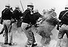 Police attack civil rights demonstrators outside Selma, Alabama, on Bloody Sunday.