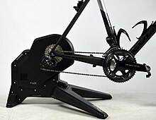 A road bike mounted on a direct drive bicycle trainer.