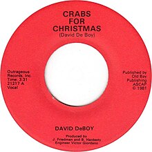 The label of Crabs for Christmas. On the top side, it says "Crabs for Christmas (David DeBoy)", "Outrageous Records, Inc. Time 3:31. 21217 A. Vocal." on the left, "Published by Old Bay Publishing ASCAP, copyright 1981" on the right, and "David DeBoy. Produced by J. Friedman and B. Hardesty. Engineer Victor Giordano." on the bottom.