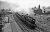 A passenger train passing the closed Hassop station (to the left in this photograph) in 1961