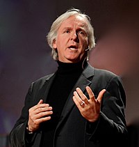 A photograph of Cameron speaking at the 2010 TED conference