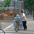 A man delivering water by bicycle in Nanjing, China