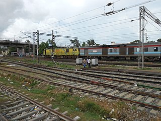Bhubaneswar Rajdhani being hauled by a Duronto-liveried WAP-7 of Ghaziabad Loco Shed.