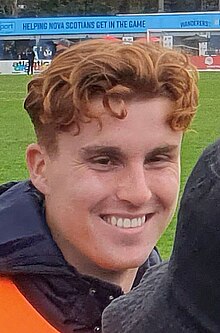 Close-up photo of a smiling man's face