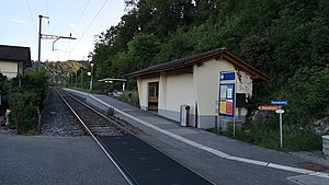 Single-tracked railway line with platform and shelter