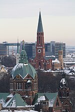 St. Luke's with the Roman Catholic church of St John the Baptist in the background