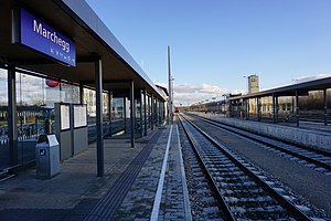 Canopy-covered platform next to two tracks