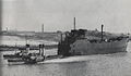 Newly built forward half being towed down the River Clyde, 1941