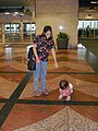 Me and my daughter in Denver International Airport; used to illustrate the article Child harness.