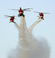 three helicopter flying in the sky