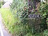 Location designator painted on a railway bridge, showing miles and chains