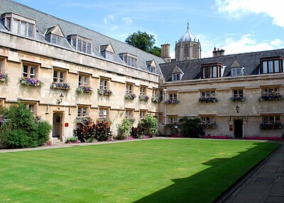 The quadrangle of Pembroke College, with Tom Tower of Christ Church behind. Pembroke was founded in 1624 and named after William Herbert, 3rd Earl of Pembroke, the Chancellor of the University. J. R. R. Tolkien wrote The Hobbit and two books of the Lord of the Rings trilogy when he was a Fellow of the college.