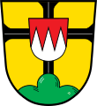 Gemeinde Hendungen In Gold auf grünem Dreiberg ein durchgehendes schwarzes Tatzenkreuz, dem in der Mitte ein Schildchen mit drei silbernen Spitzen in Rot aufgelegt ist.