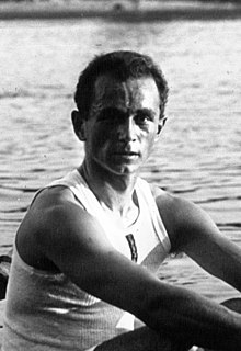 portrait of a young rower wearing a singlet on a river