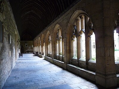 The cloisters of New College. Founded in 1379 by William of Wykeham, Bishop of Winchester, the college has educated distinguished names such as the author John Galsworthy, the legal philosopher H. L. A. Hart and the art historian Neil MacGregor.