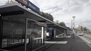 Single-tracked railway line with canopy-covered platform