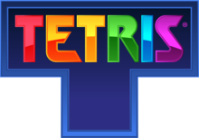 The word "Tetris", each letter a different color, engraved on a blue, T-shaped tetromino.