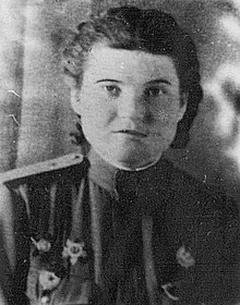 Photograph of Vera Belik. She is wearing a Guards pin and an Order of the Red Star medal.