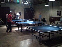 A ping pong table inside of the restaurant