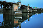 Concrete and metal bridge at night