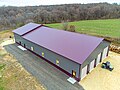 Image 1Post frame Barndominium with standing seam metal roof. Large garage on the front side and living space on the back end. (from List of house types)