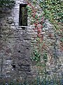 north wall of the church; postholes where wooden steps allowed access to the tower are visible.