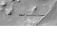 Possible dike in Thaumasia quadrangle, as seen by HiRISE under the HiWish program. Dikes may have deposited valuable minerals.