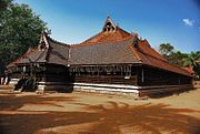 Most Kerala buildings visually appear to have low height, due to over-sloping of roofs, which protect walls from rain and direct sunshine.