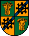 Gemeinde Fraham Geviert von Grün und Gold; 1 und 4 eine goldene Getreidegarbe, zwei und drei eine blaue, linke Schrägleiste, überdeckt durch ein schwarzes Mühlrad.