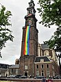 Een reusachtige regenboogvlag hangend aan de Westertoren in Amsterdam, gedurende de Amsterdam Gay Pride (2012)