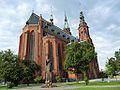 Photo taken from Powstańców Wielkopolskich Square. The monument of John Paul II in the foreground