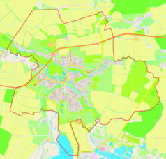 Mapa konturowa Buska, w centrum znajduje się ikonka pałacu z opisem „Pałac Badenich w Busku”