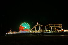 Santa Monica Pier at night with Ferris wheel lit up in green and red