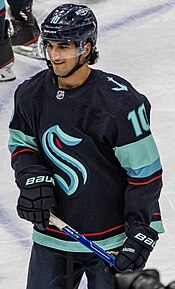 Matty Beniers in a blue Seattle Kraken hockey jersey