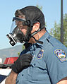 Police wearing mask showing side view