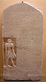 (minor upper lunette) Deeply incised, bas-relief main body of stele