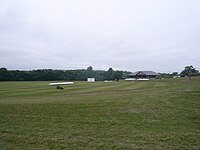 A colour photo of a cricket ground