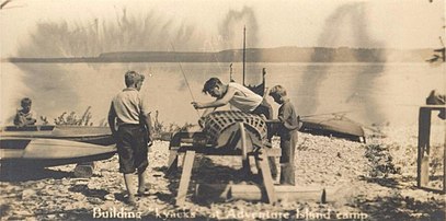 Boys building kayaks at Adventure Island Camp. Adventure Island is also known as Big Strawberry Island.