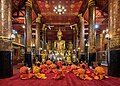 Image 2Praying bhikkhus inside Wat Mai Suwannaphumaham in Luang Prabang Laos  4
