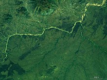 The river pictured from far above, surrounded by green.