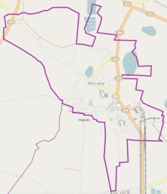 Mapa konturowa Kleczewa, blisko centrum u góry znajduje się punkt z opisem „Kościół św. Andrzeja Apostoła w Kleczewie”