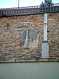 The northern boundary wall of the palace grounds, featuring a Baroque construction inscription, located beneath the present-day Kurpark-Hotel.