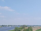 Doorkijk naar links Scherenwelle (Wilsum) en rechts Onderdijkse Waard o.a. Op Kampen, Foto genomen vanaf de Molenbrug (Kampen) I