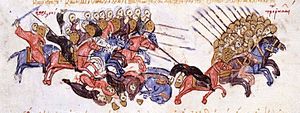 Ortaçağ minyatürü bir grup ağır zırhlı süvari peşinde sarıklı bir grup biniciyi gösteriyor