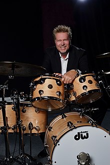 John Robinson sitting behind a Drum Workshop drum kit