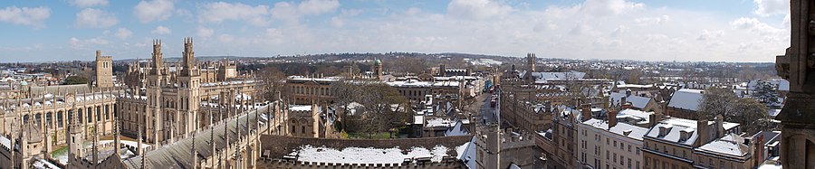 The Oxford skyline from the University Church of St Mary the Virgin looking to the east; All Souls College is in the foreground, with The Queen's College behind further along the High Street, and the tower of St Peter-in-the-East (now the library of St Edmund Hall) is at the far left.