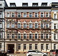 Mietshaus in geschlossener Bebauung und Werkstattgebäude im Hof