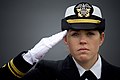 Ship's Navigator Lt. j.g. Shaina Hayden renders honors to the national anthem during the commissioning ceremony for the littoral combat ship USS Freedom (LCS 1) at Veterans Park in Milwaukee, Wis.