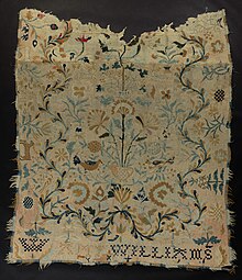 This is a floral bed rug which is intensely stitched, and those running stitches are fairly loose.